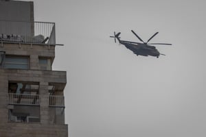 Helicopter flying over Jerusalem. Illustration.