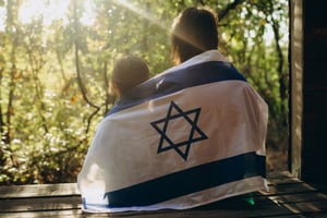 2 kids wearing the Israeli flag