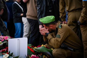 Family and friends attend the funeral of Israeli soldier First Sergeant Aviel Wiseman, at the military cemetery in Poria Illit on January 14, 2025, He was killed during a ground operation in the Gaza Strip