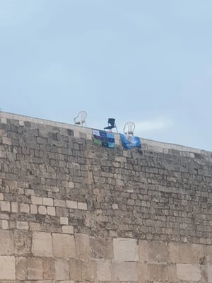 Signs hung on the Kotel today