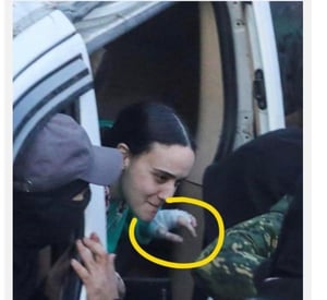 Emily Damari being passed from Hamas terrorists to the Red cross during her release from Gaza captivity