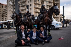 Ultra orthodox Jews protest and clash with police during a protest against the drafting of ultra orthodox jews to the Israeli army, outside a conference of ultra-Orthodox soldiers in Jerusalem, January 28, 2025