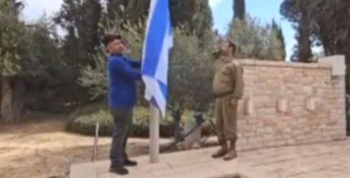 Watch: The Israeli Flag is Re-raised at the Military Cemetery in Re'im