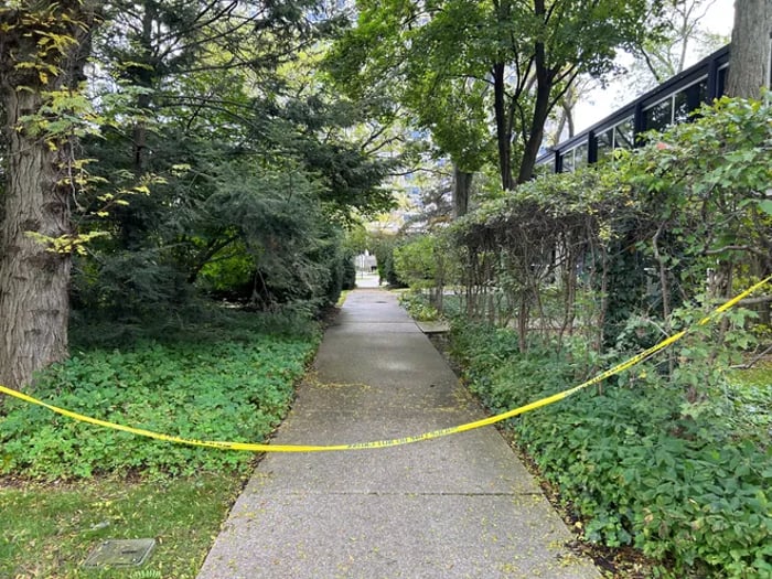 Police tape blocks the crime scene