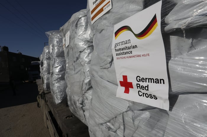 Trucks with aid arrive at the Palestinian side of the Kerem Shalom border crossing, in the southern Gaza Strip, on February 17, 2024. 