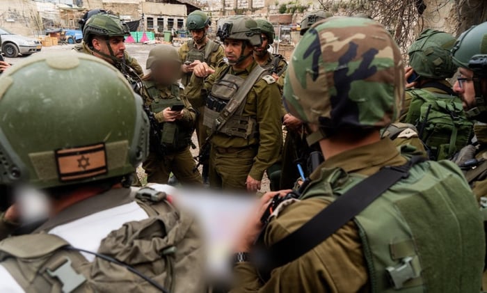 IDF soldiers at terrorist attack site, after neutralization of terrorist.