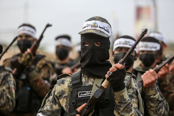 Palestinian militants from the Ansar brigade, the military wing of the Palestinian Freedom Movement, take part in a military drill in Khan Yunis, in the southern Gaza Strip, on January 1, 2023.