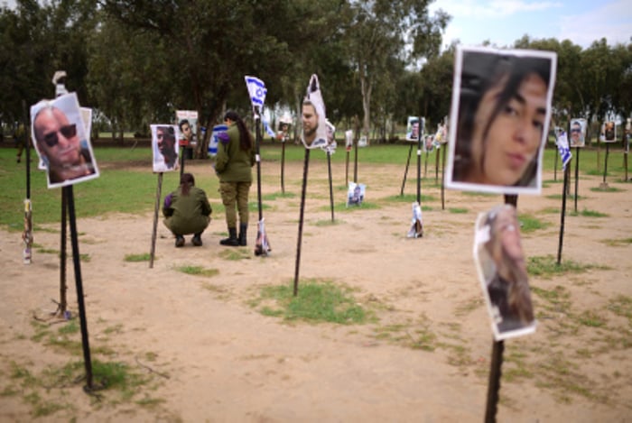 Israeli soldiers visit the site of the Nova music festival massacre, in Re'im, near the Israeli-Gaza border. 