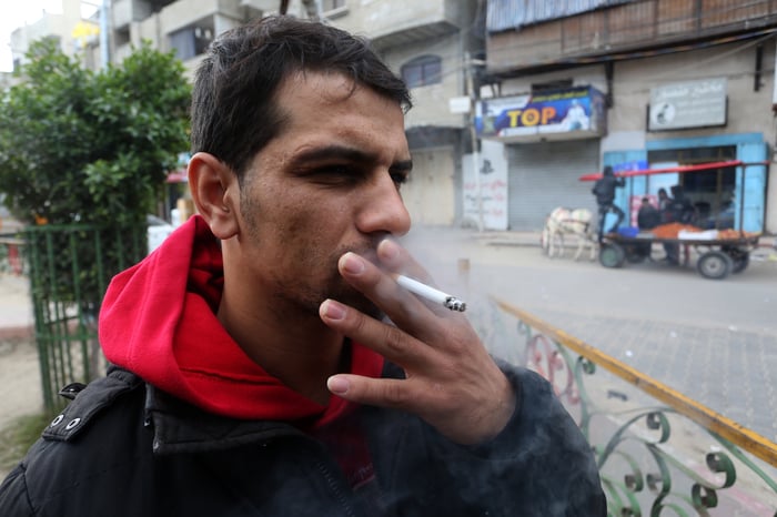 A Palestinian man selling cigarettes in his shop, at Rafah in southern Gaza Strip.                          