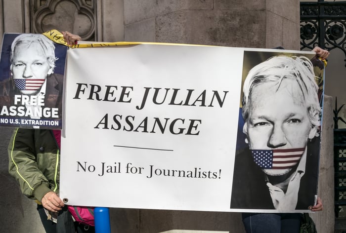 Supporters of WikiLeaks founder Julian Assange take part in a protest near Westminster against Julian Assange's potential deportation to USA.