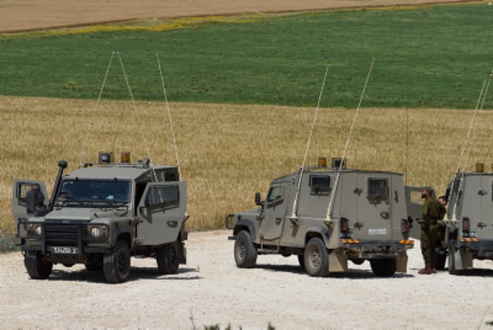 Israeli soldiers patrol near the Israel-Gazan border 