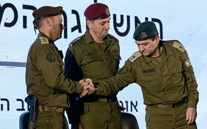 Outgoing head of the IDF Military Intelligence Directorate, Maj. Gen. Aharon Haliva (right) incoming commander of the directorate, Maj. Gen. Shlomi Binder (left) and Chief of Staff Lt. Gen. Herzi Halevi (center) attend a handover ceremony at the Glilot Base near Herzliya, August 21, 2024