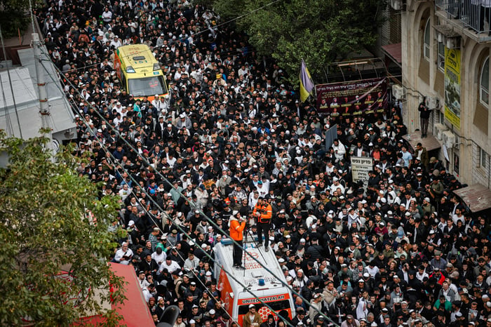 Jewish men in the street during Tikkun HaKlali near the tomb of Rabbi Nachman of Breslov in Uman, on eve of Rosh Hashanah, October 2, 2024