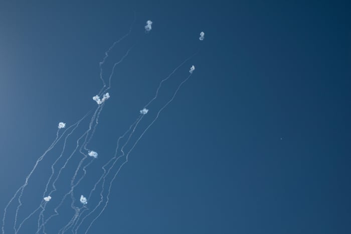 An anti-missile system fires interception missiles as rockets fired from Lebanon, as seen from Hula Valley