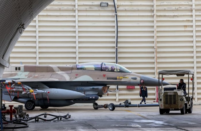 Israeli air force technicians working on a F-16 Fighting Falcon in Ramat David Airbase, northern Israel, January 14, 2024.