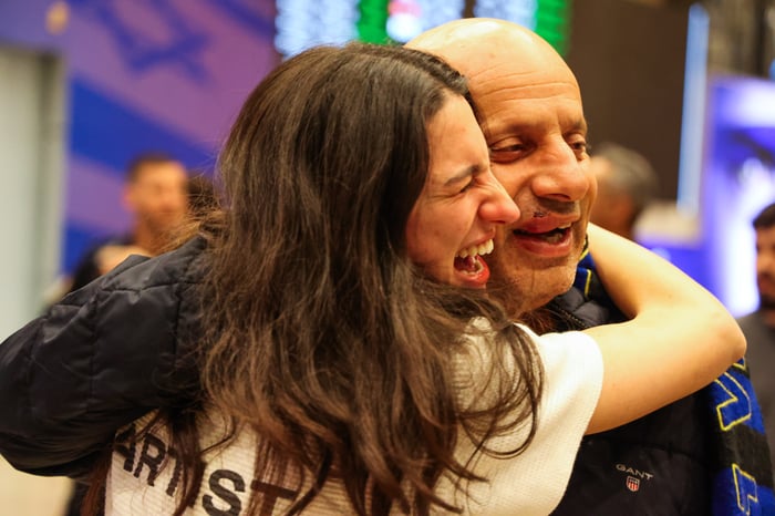 Maccabi Tel Aviv fans who flew on El Al rescue flight from Amsterdam arrive to the arrivals hall of the Ben Gurion international airport, near Tel Aviv, November 8, 2024