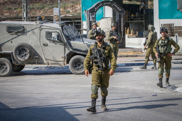 Israeli soldiers near the scene of a shooting, near the West Bank settlement of Shavei Shomron