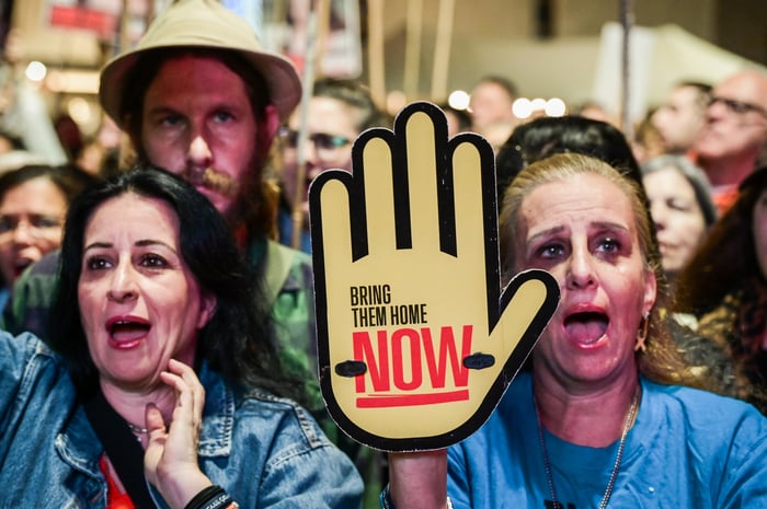 Israelis attend a rally calling for the release of Israelis held hostage by Hamas terrorists in Gaza, at "Hostage Square" in Tel Aviv, December 7, 2024. 