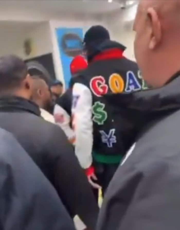 Mayweather surrounded in a shop