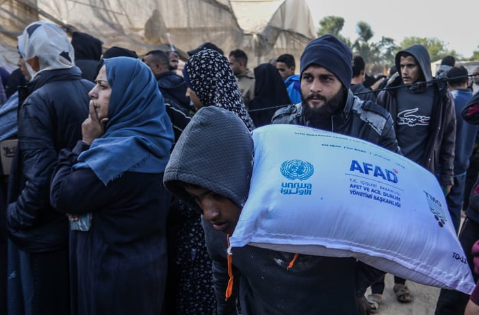 UNRWA providing Palestinians with flour.