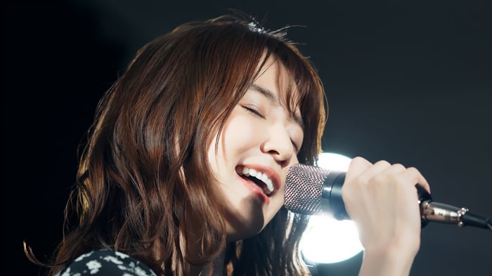 Woman singing karaoke.