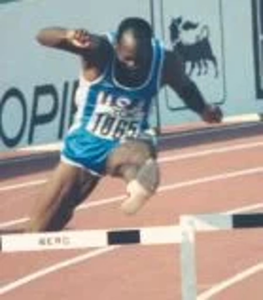 Edwin Moses during a race
