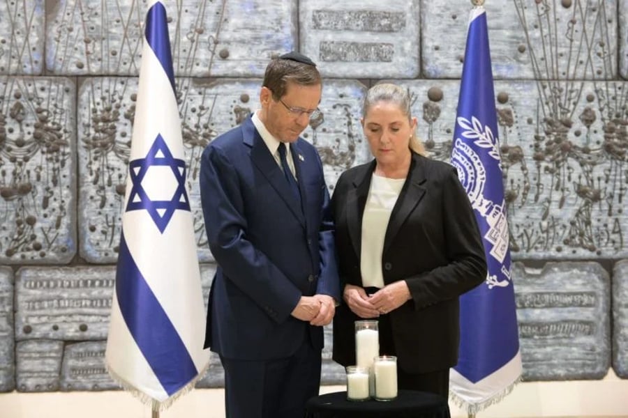 President Herzog and his wife Michal light a candle