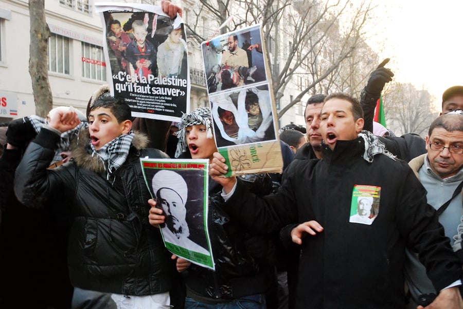 Opposed to Israel's war, divided on Hamas' actions. French Muslims protesting a previous round of conflict in Gaza.