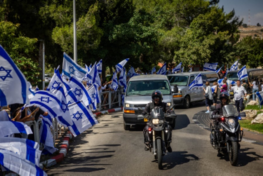 Israelis pay their respect to Special Forces officer Arnon Zamora, outside his family home in Mevaseret Zion, June 9, 2024.  