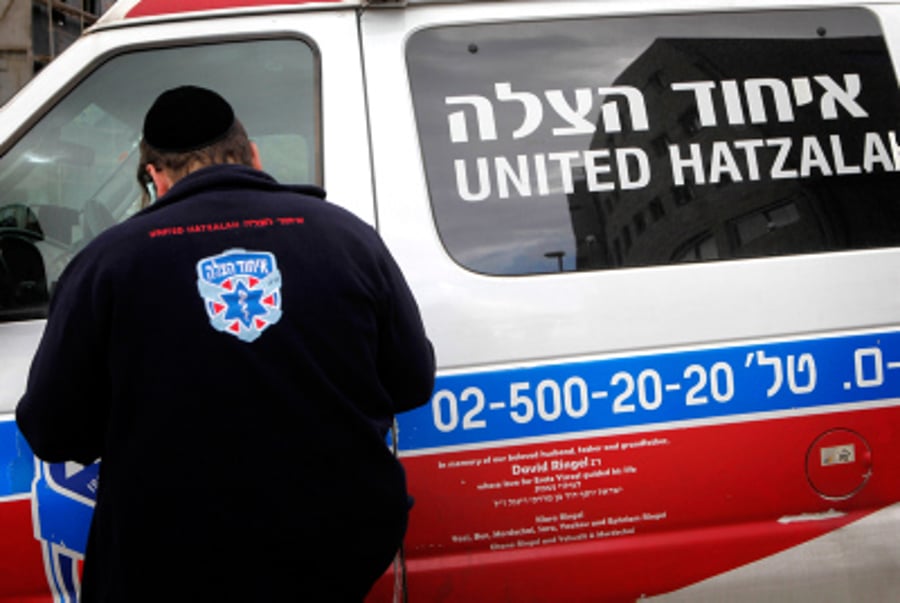 An orthodox Jewish volunteer of the Emergency Medical Service organization, United Hatzalah, seen near an ambulance in Jerusalem. 