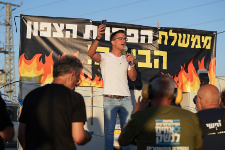 Moshe Radman speaks during a protest at Amiad Junction, in northern Israel, July 6, 2024. 