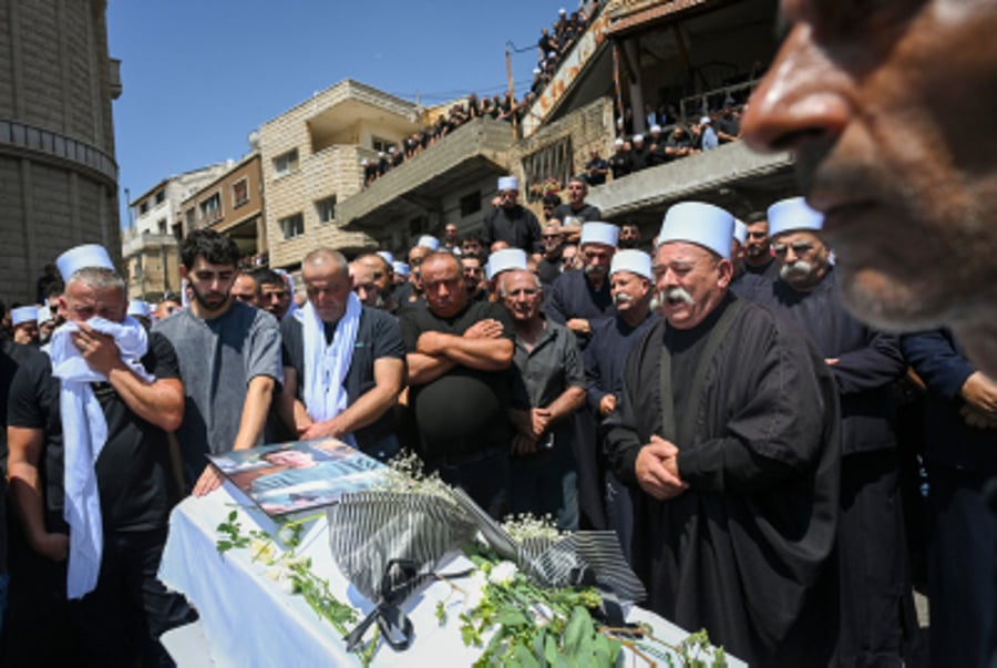 Family and friends attend the funeral service of druze children in Majdal Shams, in the Golan Heights, July 28, 2024. 