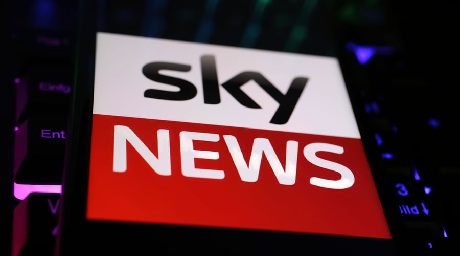 Smartphone with Sky News logo 