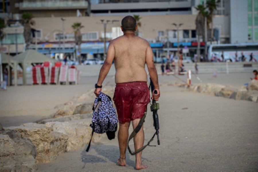 Israelis enjoy the beach in Tel Aviv, on a hot summer day. July 24, 2024.