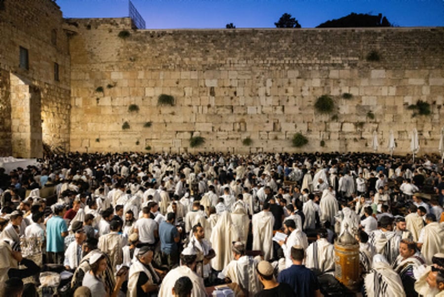 Jewish men pray during Tisha B'Av, at the Wall Western, in the Old City of Jerusalem