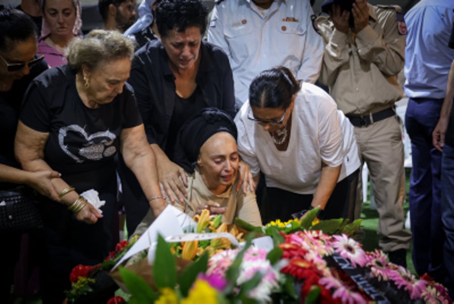 Family and friends of Israeli soldier First Sergeant David Moshe Ben Shitri attend his funeral at the Mount Herzl Military Cemetery