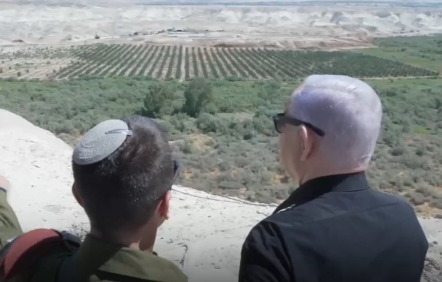 Netanyahu looking out at the Jordan River.