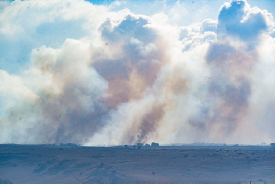 Smoke rises from a fire which broke out from missiles fired from Lebanon in the Golan Heights, on September 15, 2024.