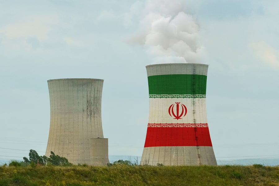 The flag of Iran is depicted on the cooling tower of a nuclear power plant