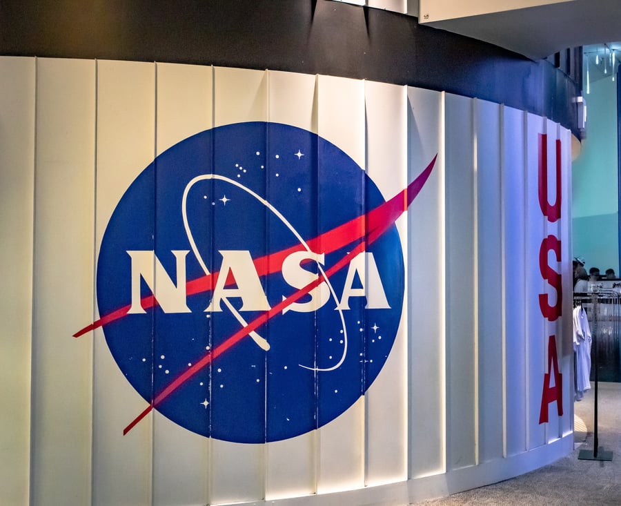 Red and blue NASA logo on a metal wall. Photo taken at the Johnson Space Center in Houston Texas