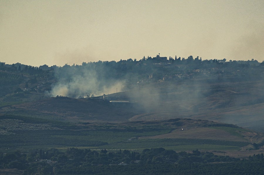 Smoke rises after a missile launched from Lebanon hit a house in Metula