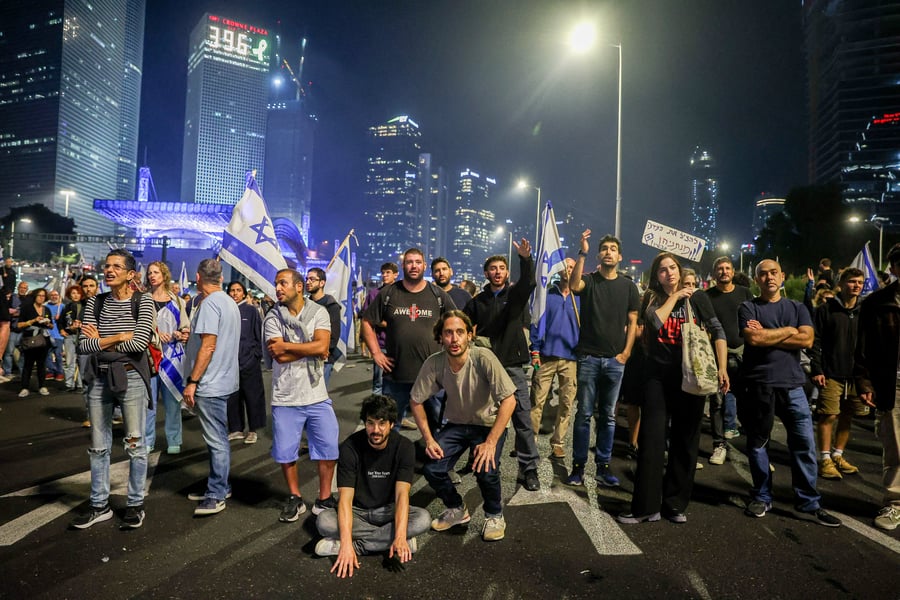 Israelis protest the firing of Israel's Defense Minister, Yoav Gallant