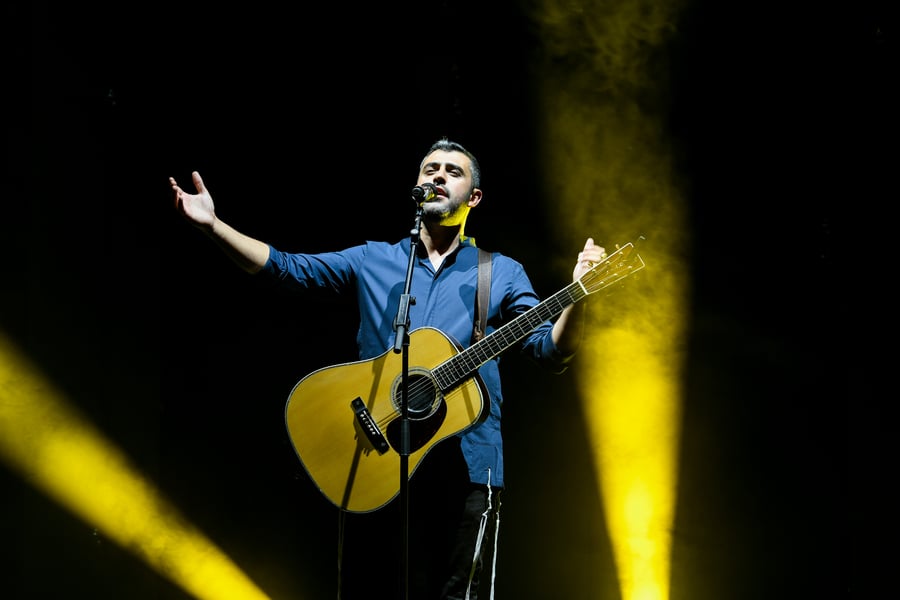 Israeli singer Ishay Ribo performing live at the Sultan's Pool in Jerusalem