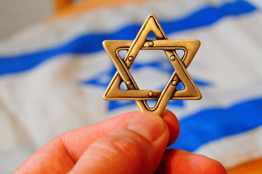 A Magen David (Jewish star hexagram) with Israeli flag on the background