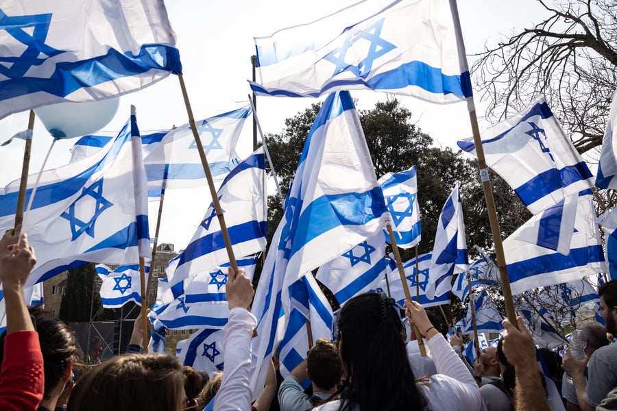 Jewish women wave Israeli flags