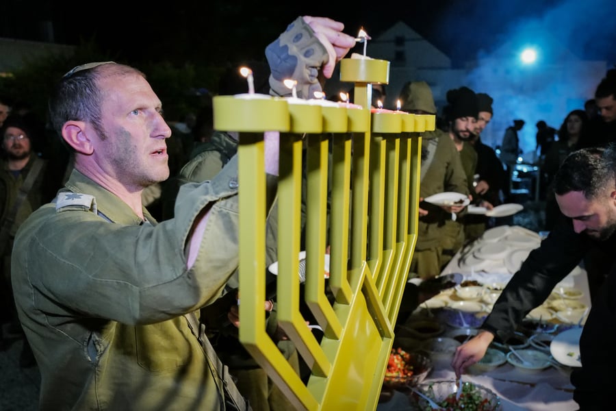 IDF paratroopers lighting a menorah.