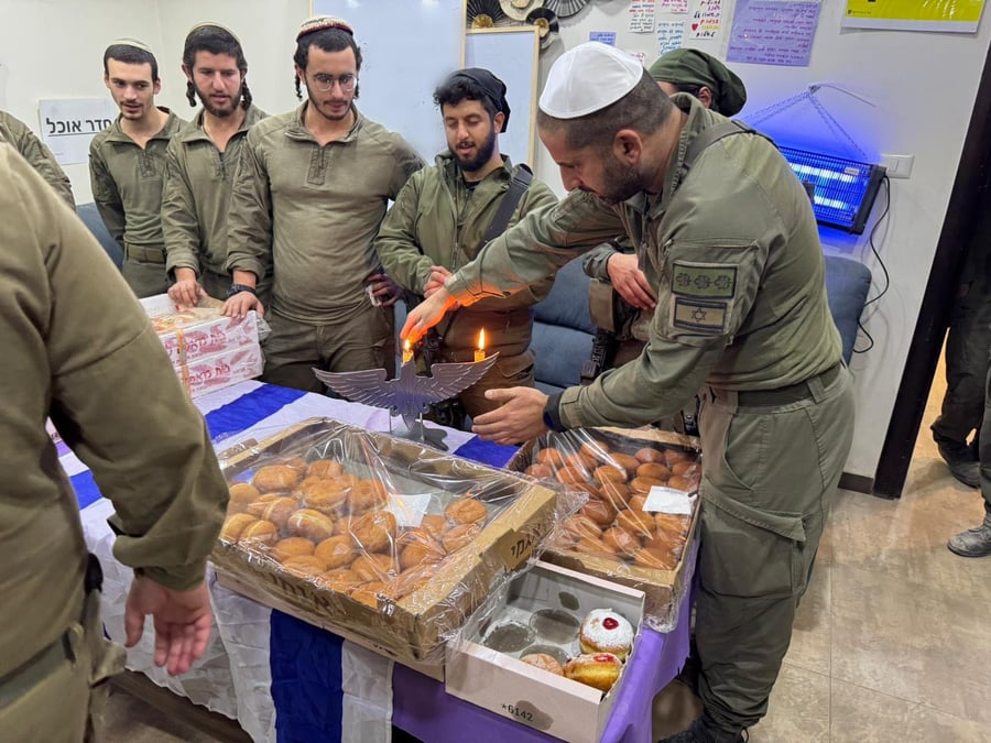 IDF soldiers enjoying Hanukkah jelly donuts in the Jebaliya area.