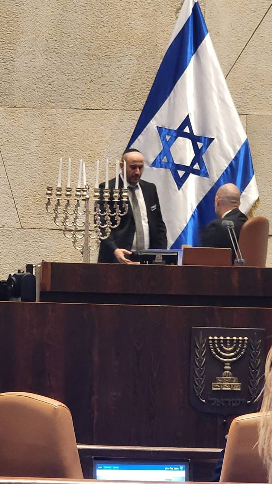 Lighting the menorah in the Knesset.