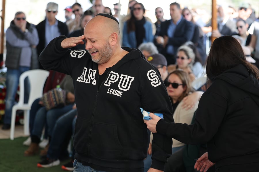 Family and friends attend the funeral of Israeli soldier Sergeant Yahav Maayan, at the military cemetery in Modi'in on January 12, 2024. He was killed during a ground operation in the Gaza Strip. 