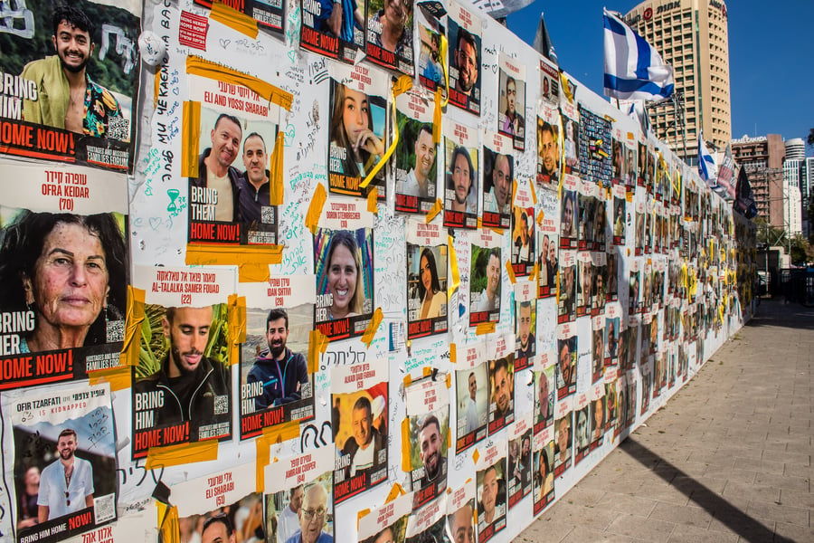 Poster with pictures of the hostages.